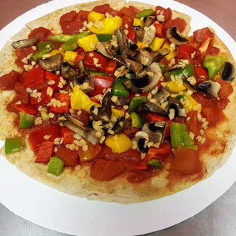 Vegan & Top 10 Allergen Free Pizza topped with a dairy free cheeze. Toppings include onions, tomatoes, sweet peppers, broccoli, mushrooms and plant based cheddar and mozzarella cheese. Please indicate on your order note and topping you would prefer to not be included.